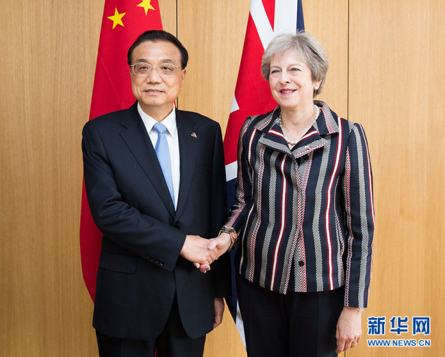Chinese Premier Li Keqiang(left) meets British Prime Minister Theresa May on the sidelines of the 12th Asia-Europe Meeting (ASEM) Summit in Brussels, Belgian, on October 19,2018. [Photo:Xinhua]