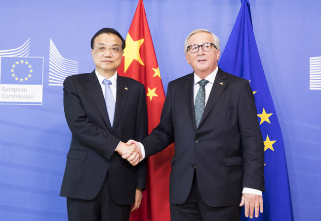 Premier Li Keqiang meets with European Commission President Jean-Claude Juncker on the sidelines of the 12th Asia-Europe Meeting Summit in Brussels, on October 19, 2018. [Photo: Xinhua]