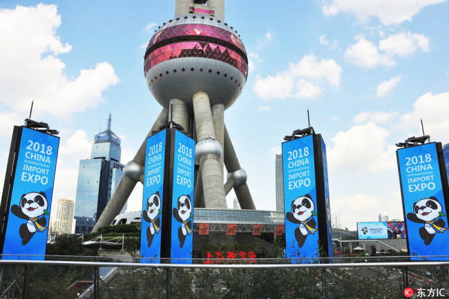 Signboards of the China International Import Expo (CIIE) are seen in front of the Oriental Pearl TV Tower at the Lujiazui Financial District in Pudong in Shanghai, China, 11 October 2018.[Photo: IC]
