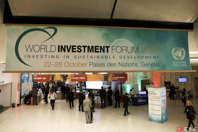 Delegates gather between the countrys' booths at the Investment Village, during the World Investment Forum 2018, at the European headquarters of the United Nations in Geneva, Switzerland, October 22 2018. [Photo:IC]