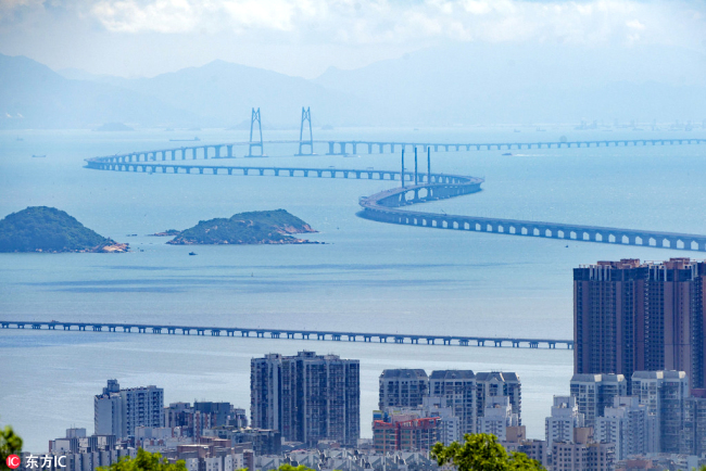 A view of the world's longest cross-sea bridge, the Hong Kong-Zhuhai-Macao Bridge, under construction against Hong Kong's Lantau Island in the background. [Photo: IC]