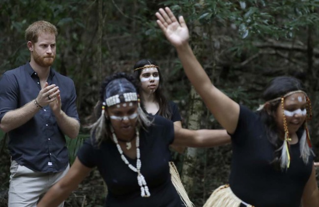 Britain's Prince Harry watches local dancers after the unveiling of the Queens Commonwealth Canopy at Pile Valley, K'gari during a visit to Fraser Island, Australia, Monday, Oct. 22, 2018. Prince Harry and his wife Meghan are on day seven of their 16-day tour of Australia and the South Pacific. [Photo: AP]