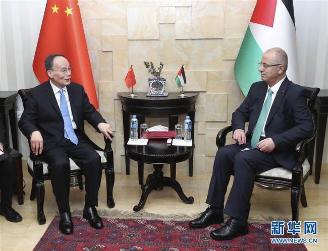 Chinese Vice President Wang Qishan(left) meets Palestinian Prime Minister Rami Hamdallah in Ramallah, Palestine, October 23 2018. [Photo:Xinhua]