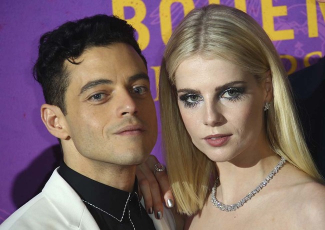 Actors Rami Malek, left, and Lucy Boynton pose for photographers upon arrival at the World premiere of the film 'Bohemian Rhapsody' in London Tuesday, Oct. 23, 2018. [Photo：AP] 