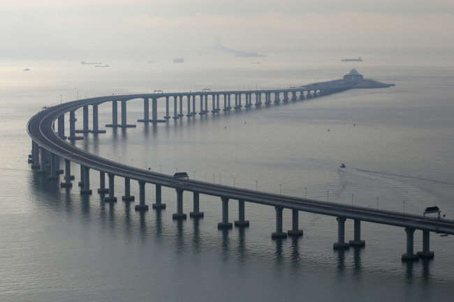 The Hong Kong-Zhuhai-Macau Bridge is seen in Hong Kong, Monday, Oct. 22, 2018. The bridge, the world's longest cross-sea project, which has a total length of 55 kilometers (34 miles), will have opening ceremony in Zhuhai on Oct. 23. [Photo: AP/Kin Cheung]