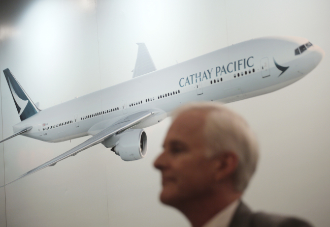 Cathay Pacific Chairman John Slosar attends a news conference as he announces the company result in Hong Kong, Wednesday, Aug. 16, 2017. Hong Kong-based Cathay Pacific Airways said on Thursday, Oct. 25, 2018, it has discovered unauthorized access to the personal data of 9.4 million passengers but had no evidence the leaked information had been misused. [File Photo: AP/Vincent Yu]