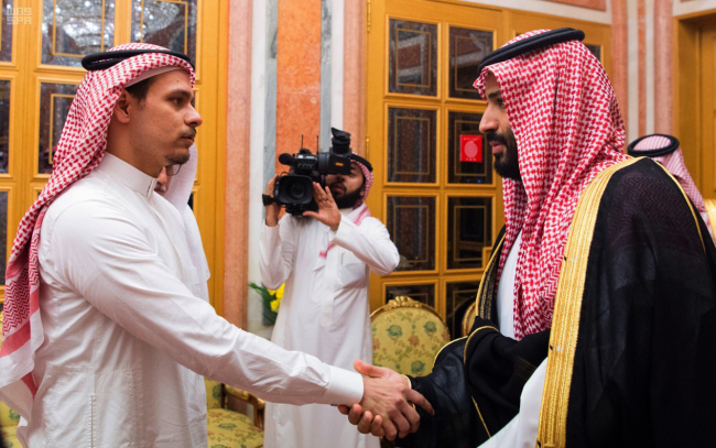 In this photo released by Saudi Press Agency, SPA, Saudi Crown Prince Mohammed bin Salman, right, shakes hands with Salah Khashoggi, a son, of Jamal Khashoggi, in Riyadh, Saudi Arabia, Tuesday, Oct. 23, 2018. Saudi Arabia, which for weeks maintained that Jamal Khashoggi had left the Istanbul consulate, on Saturday acknowledged he was killed there in a "fistfight." [Photo: Saudi Press Agency via AP]