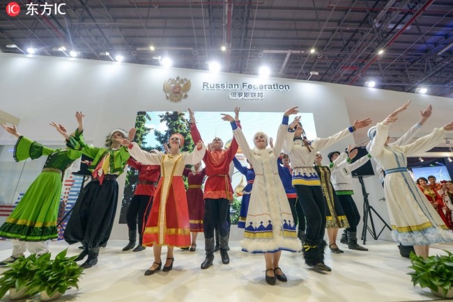 A group of young men and women perform Russian-style dancing at the first China International Import Expo (CIIE) in Shanghai on Nov 6, 2018. [Photo: IC]