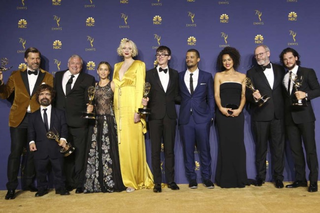 Nikolaj Coster-Waldau, from left, Peter Dinklage, Conleth Hill, Emilia Clarke, Gwendoline Christie, Isaac Hempstead Wright, Jacob Anderson, Nathalie Emmanuel, Liam Cunningham, and Kit Harington pose in the press room with the award for outstanding drama series for "Game of Thrones" at the 70th Primetime Emmy Awards on Monday, Sept. 17, 2018, at the Microsoft Theater in Los Angeles.[File photo: AP]