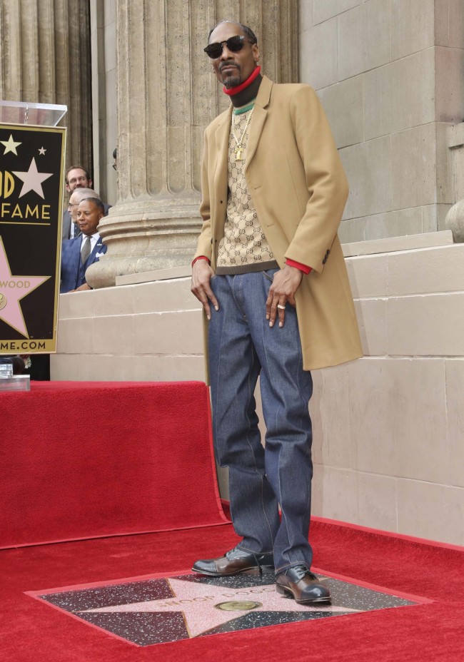 Rapper Snoop Dogg poses atop his new star on the Hollywood Walk of Fame following a ceremony in his honor on Monday, Nov. 19, 2018, in Los Angeles. [Photo: AP]
