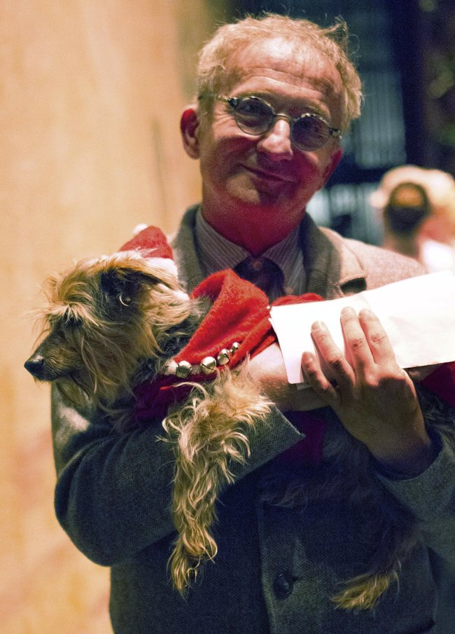 In this undated photo provided by Festival Ballet Providence, Misha Djuric, the ballet company's artistic director, holds Archie, his Yorkshire Terrier, who has performed in more than 125 performances of "The Nutcracker." Festival Ballet Providence has announced that its beloved 19-year-old Nutcracker dog is retiring from the stage. [Photo: AP]