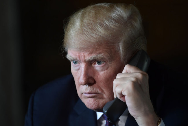 President Donald Trump talks with troops via teleconference from his Mar-a-Lago estate in Palm Beach, Fla., Thursday, Nov. 22, 2018. [Photo: AP]