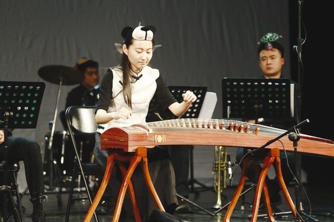 Members of the orchestra in animal headdresses perform a special symphony concert for local children in Beijing on Sunday afternoon, Nov 25, 2018. [Photo: China Plus]