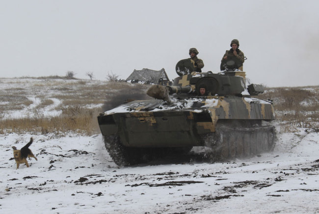 A Ukraine army APC moves toward on position at an undisclosed location in eastern Ukraine, Monday, Nov. 26, 2018. [Photo: AP/Alexander Shulman]