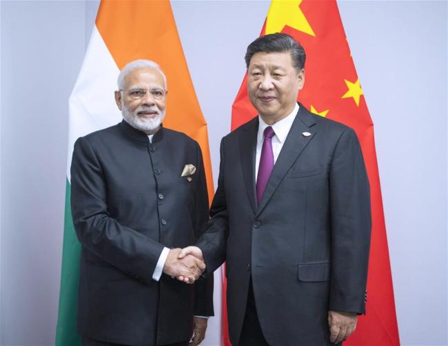 Chinese President Xi Jinping (R) meets with Indian Prime Minister Narendra Modi in Buenos Aires, Argentina, Nov. 30, 2018.[Photo: Xinhua/Li Xueren]