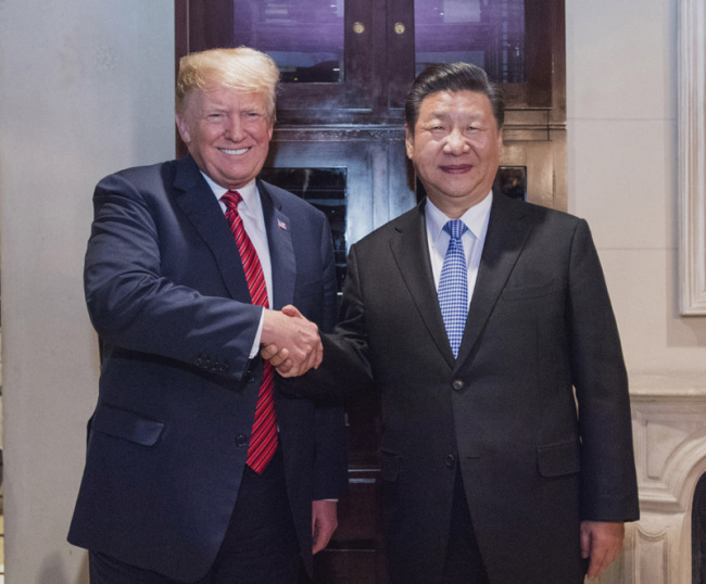 Chinese President Xi Jinping shakes hands with his U.S. counterpart Donald Trump on December 1, 2018, in in Buenos Aires, Argentina. [Photo: Xinhua]