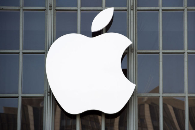 In this file photo taken on September 7, 2016 The Apple logo is seen on the outside of Bill Graham Civic Auditorium before the start of an event in San Francisco, California. [Photo: AFP]