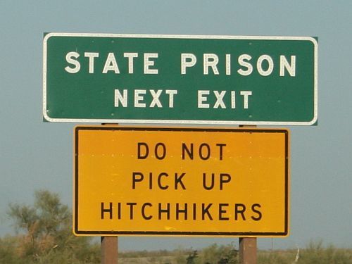 Sign in Iowa warns drivers not to pick up hitchhikers.[Photo: wikimedia commons]