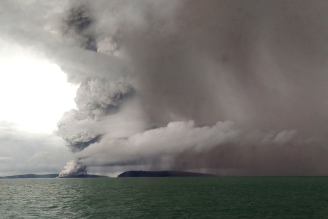 This picture taken on December 26, 2018 shows the Anak (Child) Krakatoa volcano erupting, as seen from a ship on the Sunda Straits. Indonesia on December 27 raised the danger alert level for a volcano that sparked a killer tsunami, after previously warning that fresh activity at the crater threatened to launch another deadly wave. [Photo: STR/AFP]