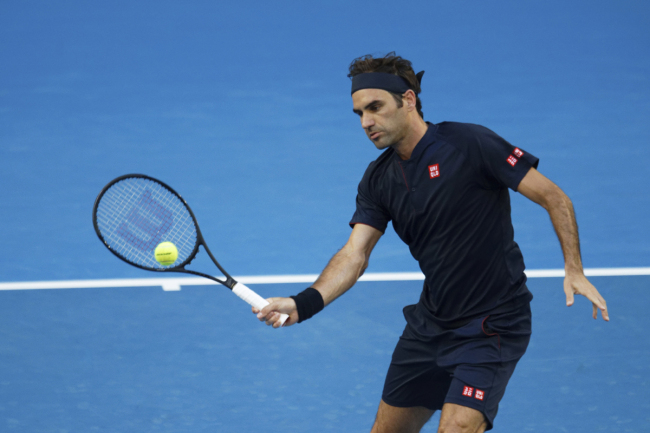 Switzerland's Roger Federer volleys during his match against Britain's Cameron Norrie at the Hopman Cup in Perth, Australia, Sunday Dec. 30, 2018. [Photo: AP]