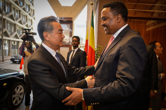 Ethiopia's Foreign Minister Workneh Gebeyehu (R) welcomes and shakes hands with China's Foreign Minister Wang Yi (L), ahead of a meeting in Addis Ababa, on January 3, 2019, during an official visit to Ethiopia. [Photo: AFP/Michael Tewelde]
