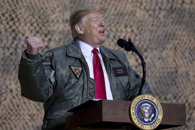 President Donald Trump speaks at a hangar rally at Al Asad Air Base, Iraq, Wednesday, Dec. 26, 2018. [File photo: AP/Andrew Harnik]