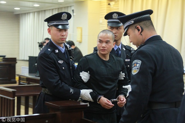 Zhang Koukou stands trial at a court in Hanzhong, Shaanxi Province on January 8, 2019. [Photo: VCG]