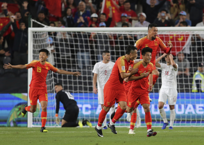 China's defender Wu Lei, center right, celebrates his goal with his teammates during the AFC Asian Cup group C soccer match between China and Phillipines at Mohammed Bin Zayed Stadium in Abu Dhabi, United Arab Emirates, Friday, Jan. 11, 2019. [Photo: AP/Kamran Jebreili]