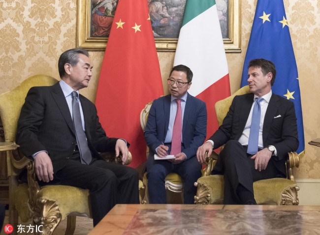Italian Prime Minister Giuseppe Conte (R) meets with Chinese State Councilor and Foreign Minister Wang Yi (L) at the Chigi Palace in Rome, Italy, on Friday, January 25, 2019. [Photo: EPA/Filippo Attili/Chigi Palace Press Office/Handout]