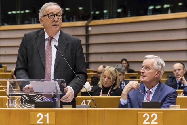 EU Commission President Jean Claude Juncker, left, stands next to European Union chief Brexit negotiator Michel Barnier as he addresses Members of European Parliament on Brexit during a plenary session at the European Parliament in Brussels on Wednesday Jan. 30, 2019. [Photo: AP] 
