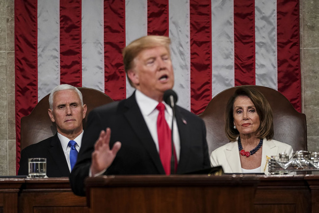  President Donald Trump gives his State of the Union address to a joint session of Congress, Tuesday, Feb. 5, 2019 at the Capitol in Washington, as Vice President Mike Pence, left, and House Speaker Nancy Pelosi look on. [Photo: AP]