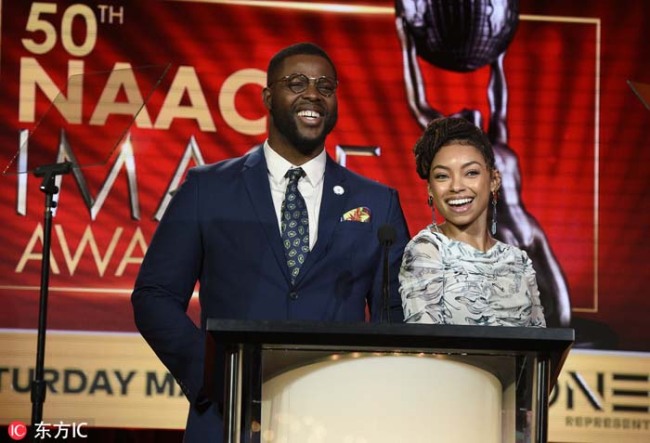 Winston Duke, left, and Logan Browning announce nominations for the 50th annual NAACP Image Awards during TV One's Winter Television Critics Association Press Tour on Wednesday, Feb. 13, 2019, in Pasadena, Calif. [Photo：IC]