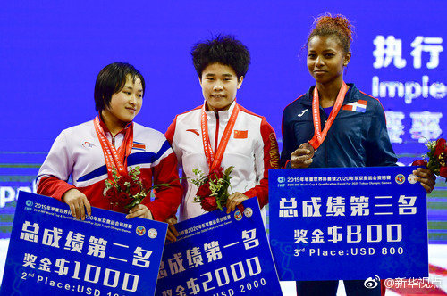 Chinese weightlifter Hou Zhihui(Middle) wins women's 49kg division of International Weightlifting Federation (IWF) World Cup with two new world records in Fuzhou, Fujian Province, on Saturday, Feb. 23, 2019.[Photo: Xinhua]