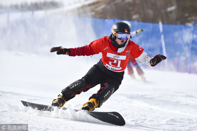 Gong Naiying of China is in action during the Women's Snowboard Parallel Slalom World Cup at the Chongli Snow Park in Zhangjiakouon 24th of February 2019. [Photo: VCG]