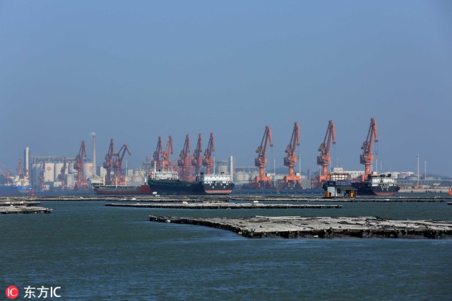 Cargo ships are seen at the Qinzhou Port in Qinzhou city, south China's Guangxi Zhuang Autonomous Region, 18 December 2017. [Photo: IC]