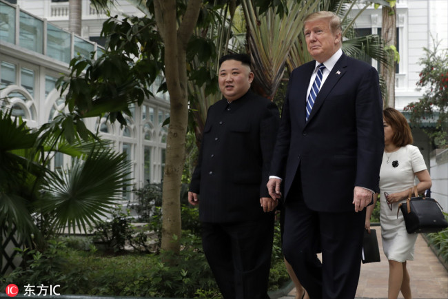 U.S. President Donald Trump and DPRK's top leader Kim Jong Un take a walk after their first meeting at the Sofitel Legend Metropole Hanoi hotel, Feb. 28, 2019, in Hanoi. [Photo: IC]