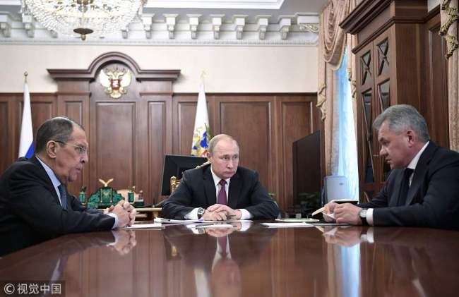 Russia's President Vladimir Putin (C) attends a meeting with Russia's Foreign Minister Sergei Lavrov (L) and Defence Minister Sergei Shoigu in Moscow on February 2, 2019. [Photo: VCG/ Sputnik / Alexey NIKOLSKY]