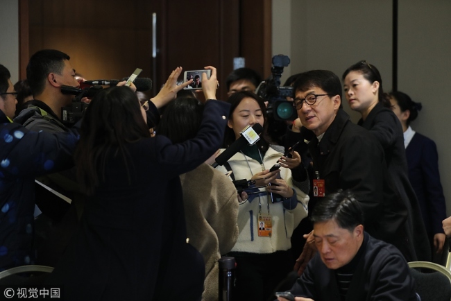 Jackie Chan was interviewed by journalists along the sidelines of the ongoing CPPCC sessions in Beijing on March 4, 2019.[Photo: vcg.com]