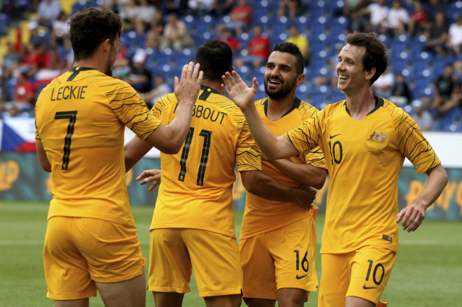From left, Australia's footballer Mathew Leckie and his teammates Andrew Nabbout, Aziz Behich and Robbie Kruse celebrate the opening goal during a friendly match between Australia and Czech Republic in St Poelten, Austria, Friday, June 1, 2018. [File photo: AP]