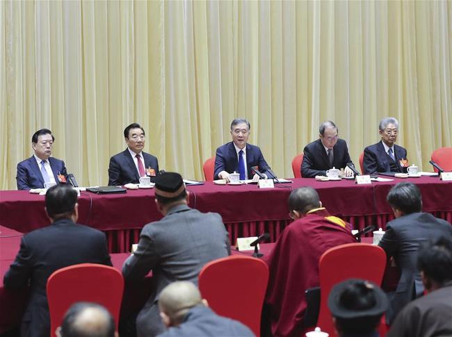 Wang Yang, a member of the Standing Committee of the Political Bureau of the Communist Party of China (CPC) Central Committee and chairman of the National Committee of the Chinese People's Political Consultative Conference (CPPCC), joins a panel discussion with political advisors from the religious circles at the second session of the 13th CPPCC National Committee in Beijing, capital of China, March 4, 2019. [Photo: Xinhua/Yao Dawei]