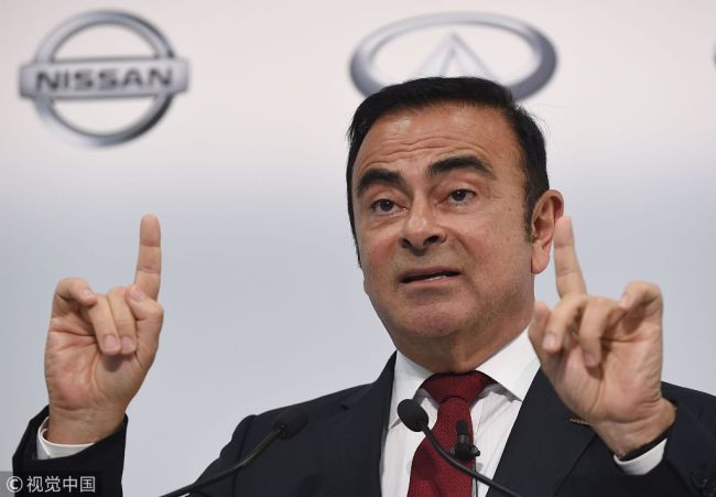 In this file photo taken on May 11, 2012, former President and CEO of Japan's auto giant Nissan Carlos Ghosn gestures as he answers questions during a press conference at the headquarters in Yokohama, suburban Tokyo. [Photo:VCG]