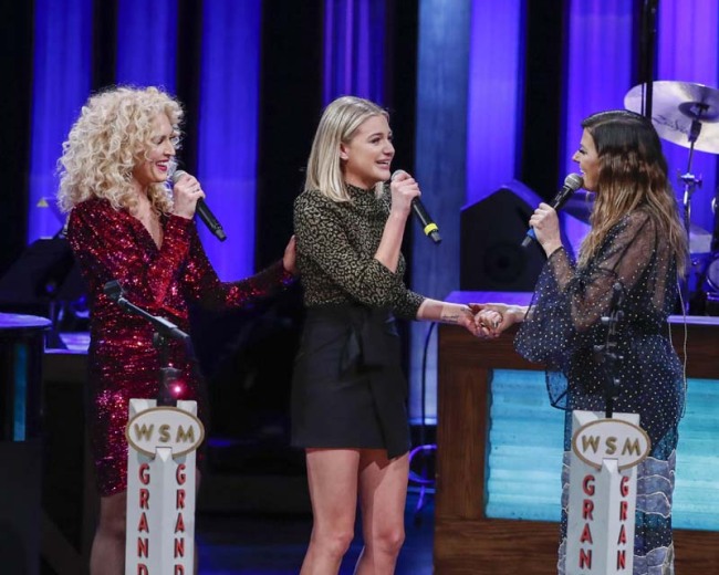 Kelsea Ballerini, center, is invited to join the Opry by Kimberly Schlapman, left, and Karen Fairchild, right with Little Big Town at the Grand Ole Opry on Tuesday, March 5, 2019, in Nashville, Tennessee.  [Photo: IC]