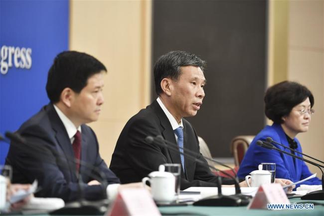 China's Minister of Finance Liu Kun (C) answers questions at a press conference on the country's fiscal and tax reforms and fiscal work for the second session of the 13th National People's Congress in Beijing, capital of China, March 7, 2019.[Photo:Xinhua]