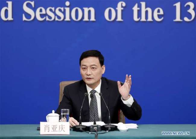 Xiao Yaqing, head of the State-owned Assets Supervision and Administration Commission of the State Council, attends a new conference on the reform and development of state-owned enterprises at the National People's Congress in Beijing on Saturday, March 9, 2019. [Photo: Xinhua]