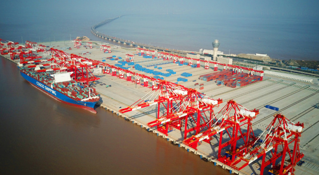 Aerial view of containers at the fourth phase of the Yangshan Deep-Water Port, the world's largest automated cargo wharf to start trial operation, in Shanghai on December 6 2017. [File Photo: IC]