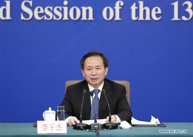 Ecology and Environment Minister Li Ganjie attends a news conference on "fighting resolutely to prevent and control pollution" as part of the second session of the 13th National People's Congress (NPC) in Beijing, March 11, 2019. [Photo: Xinhua]