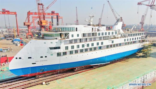 Photo taken on March 12, 2019 shows the first China-made cruise ship for polar expeditions, in Haimen, east China's Jiangsu Province. The first China-made cruise ship for polar expeditions tested the water on Tuesday in Haimen, east China's Jiangsu Province. Hu Xianfu, general manager of the shipbuilder China Merchants Group, said the 104.4-meters long vessel is 18.4 meters at the beam. It can operate at a speed of 15.5 knots. With a gross tonnage of 7,400 tonnes, it can accommodate 255 people on board. [Photo: Xinhua/Xu Congjun]