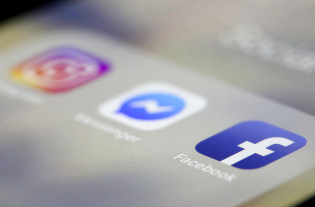Facebook, Messenger and Instagram apps are are displayed on an iPhone on Wednesday, March 13, 2019, in New York. Facebook says it is aware of outages on its platforms including Facebook, Messenger and Instagram and is working to resolve the issue. [Photo: AP]