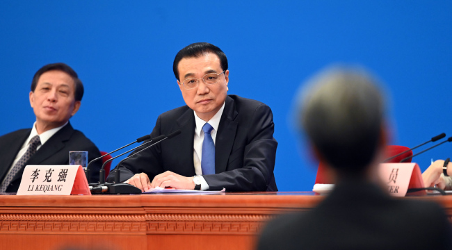 Premier Li Keqiang meets the press after the conclusion of the second session of the 13th National People's Congress at the Great Hall of the People in Beijing on Friday, March 15, 2019. [Photo: Xinhua]