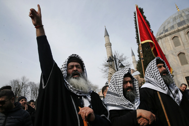 Backdropped by the Byzantine-era Hagia Sophia, demonstrators chant slogans against the mosque attacks in New Zealand during a protest in Istanbul, Saturday, March 16, 2019. World leaders expressed condolences and condemnation following the deadly attacks on mosques in the New Zealand city of Christchurch, while Muslim leaders said the mass shooting was evidence of a rising tide of violent anti-Islam sentiment.[Photo: AP/Lefteris Pitarakis]